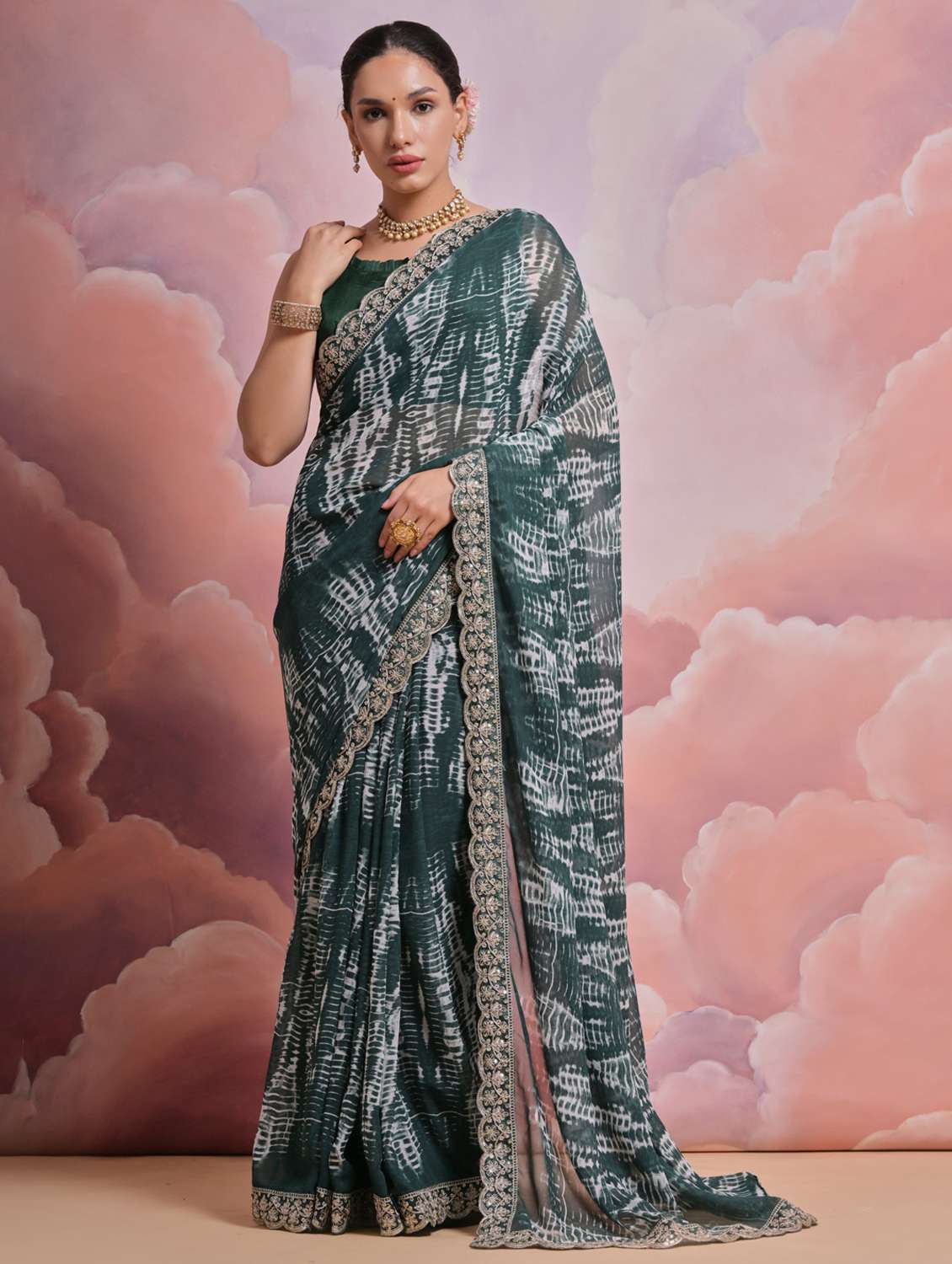 women printed embellished bordered saree with blouse