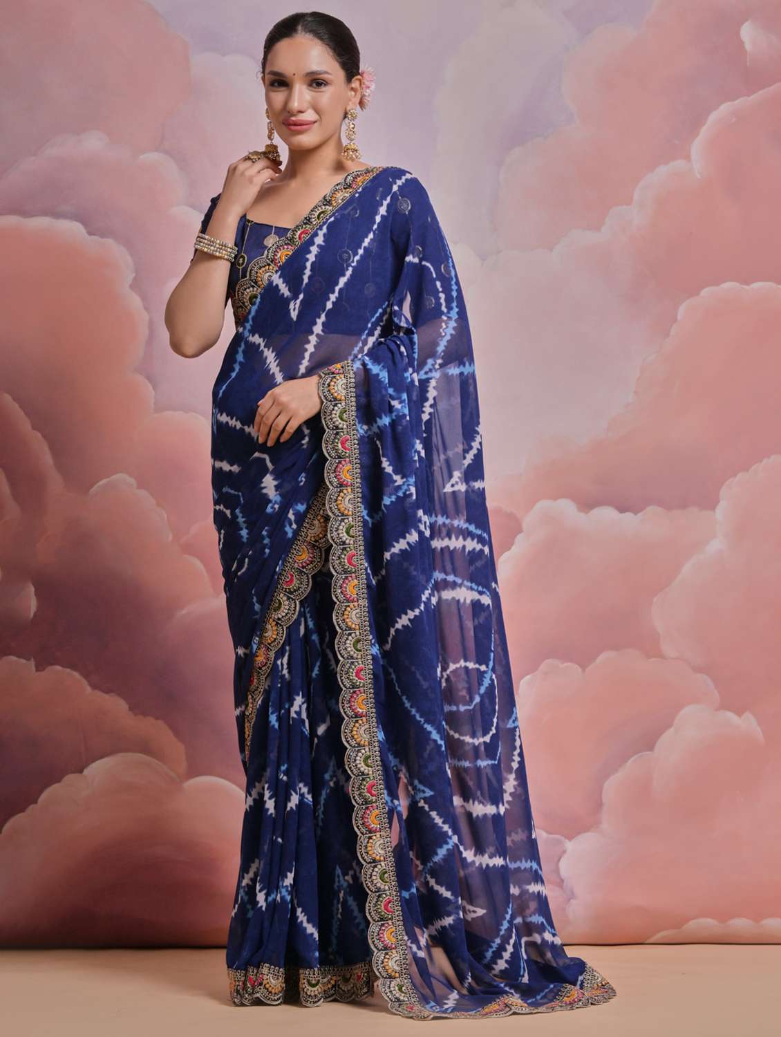 women tie & dye printed bordered saree with blouse
