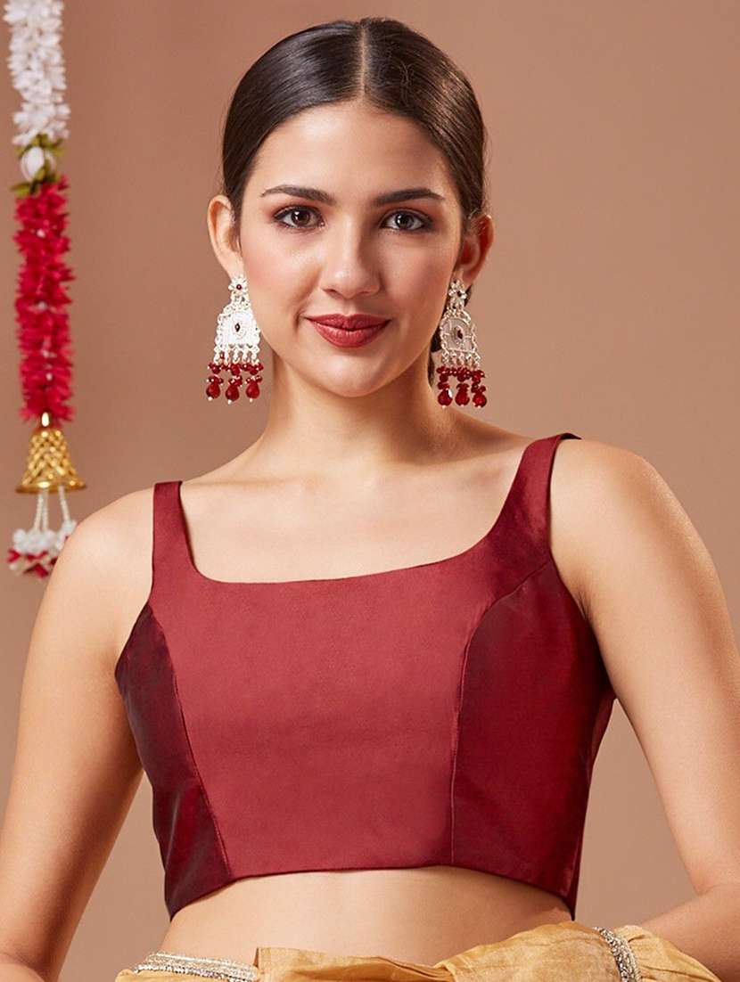 women solid sleeveless stitched blouse