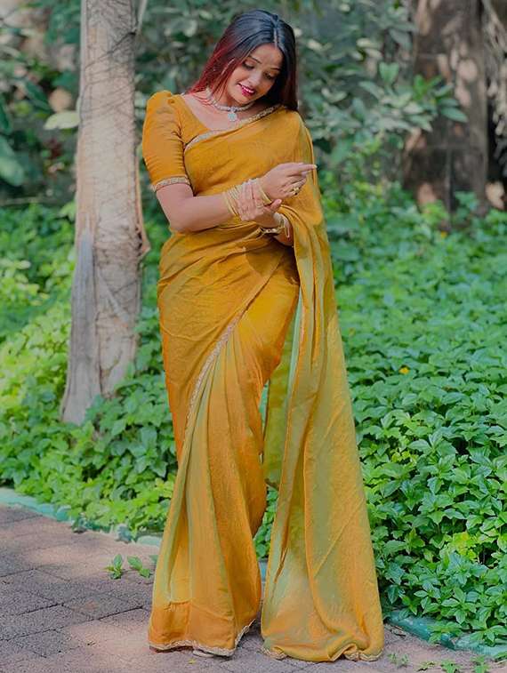 women solid with embellished bordered saree with blouse