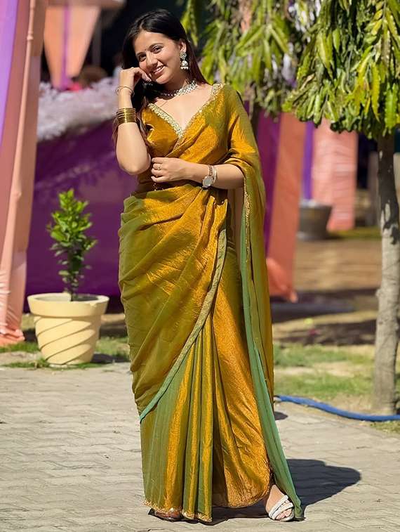women solid with embellished bordered saree with blouse