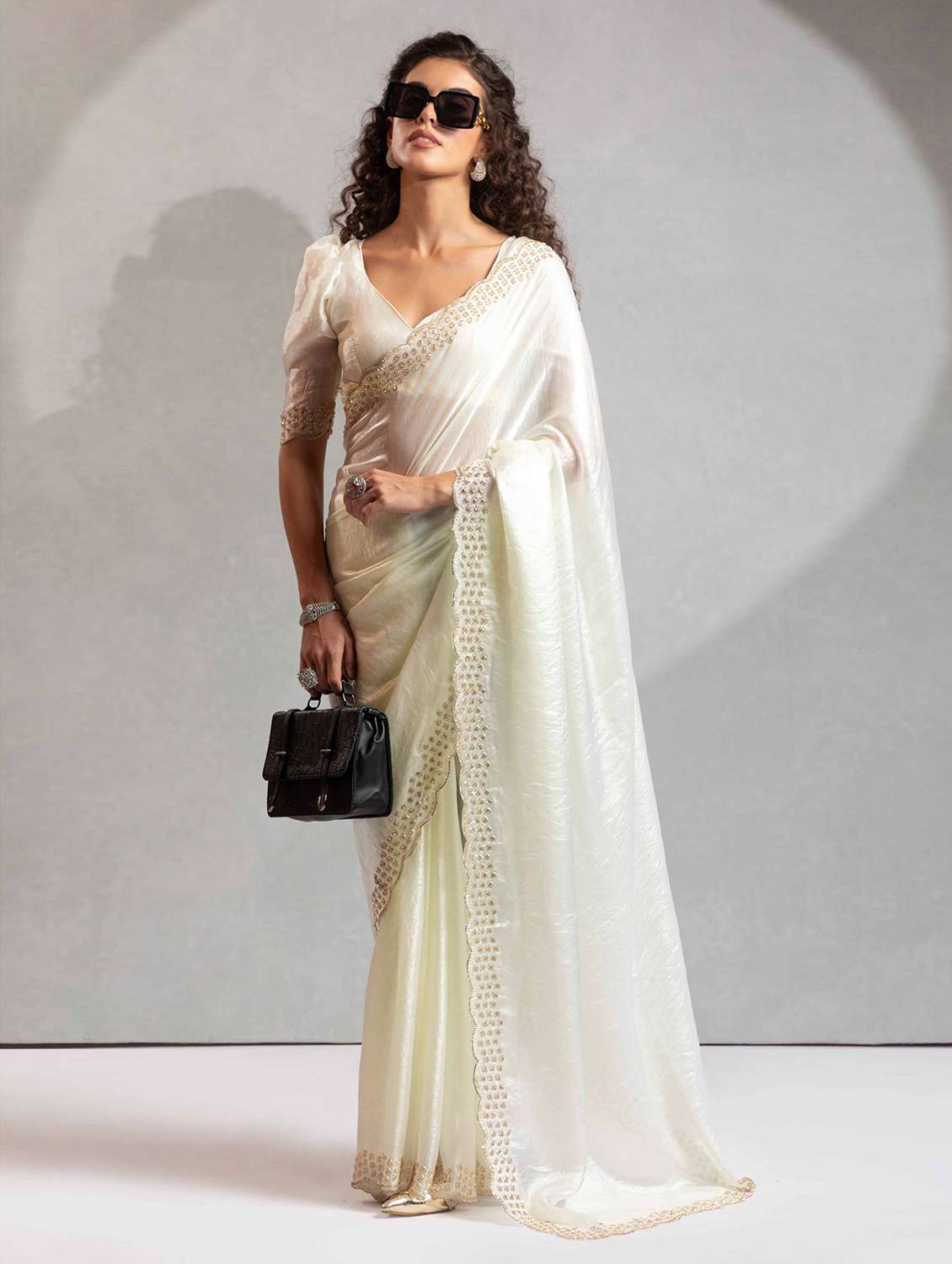 women solid with embellished bordered saree with blouse