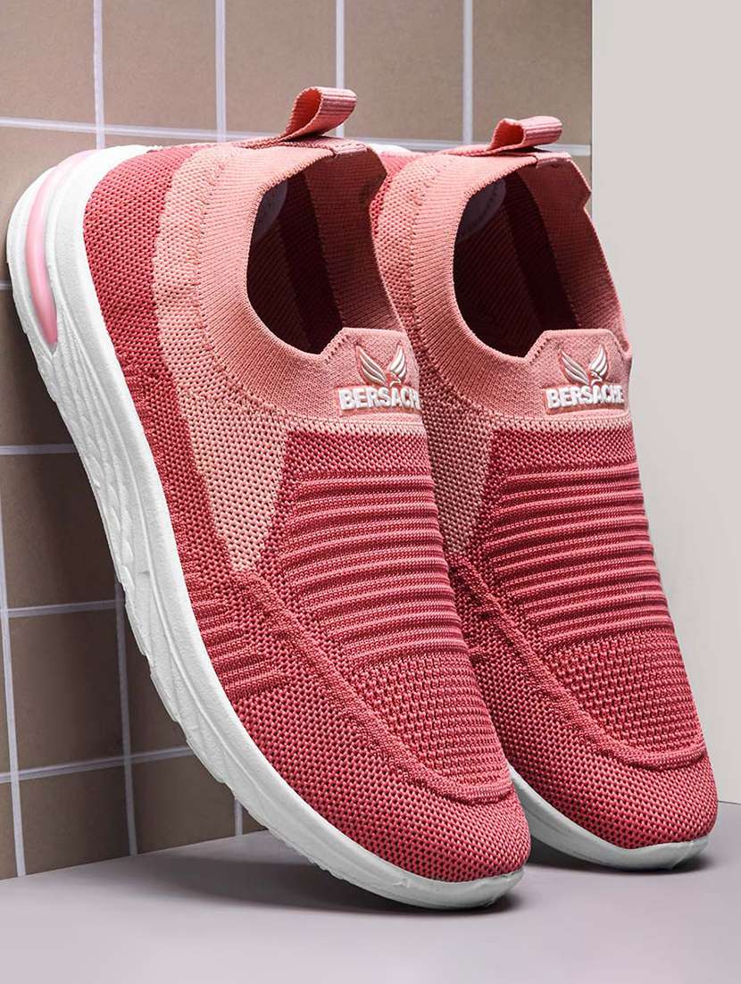 women pink slip on sports shoe