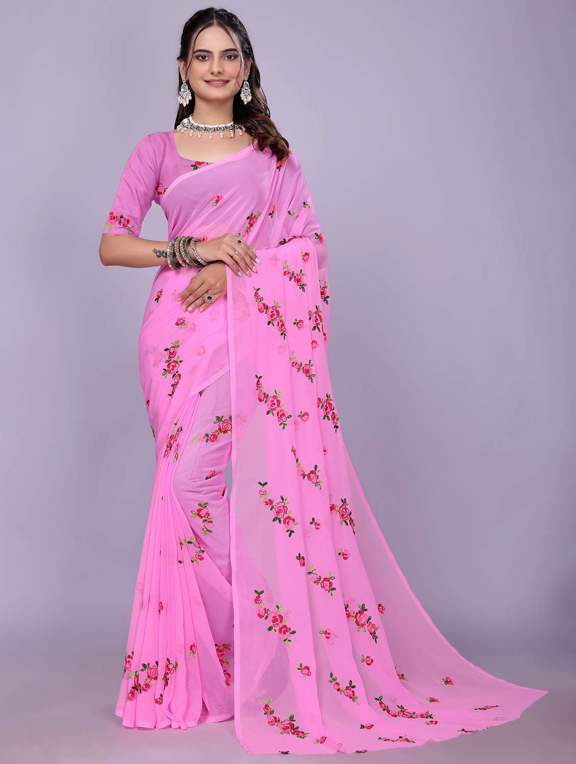 women pink embroidered saree with blouse