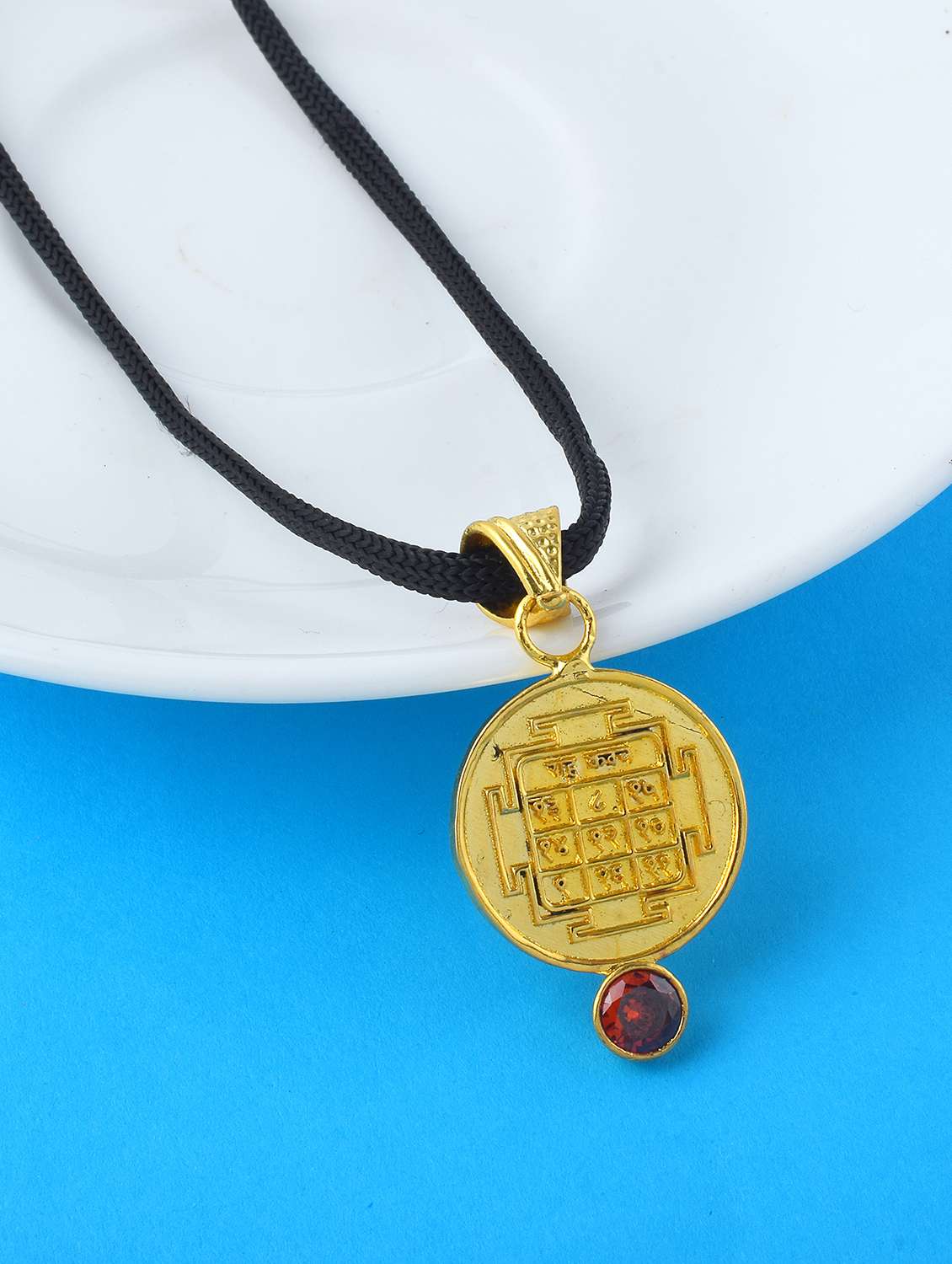 gold-plated brass pendant with gemstone
