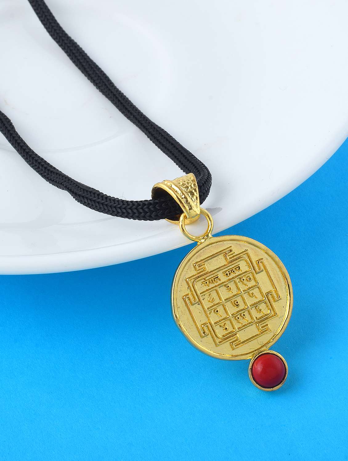gold-plated brass pendant with gemstone