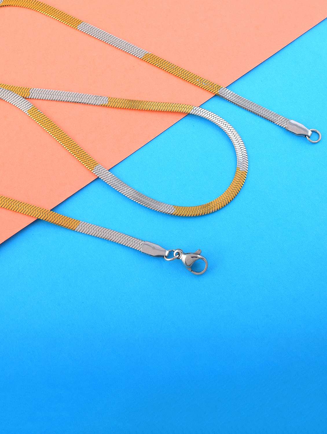 men silver and gold chain