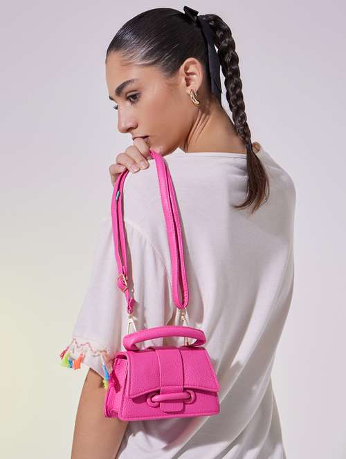 women pink solid handbag - 22176766 -  Standard Image - 0