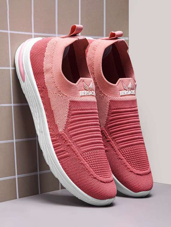 women pink slip on sports shoe