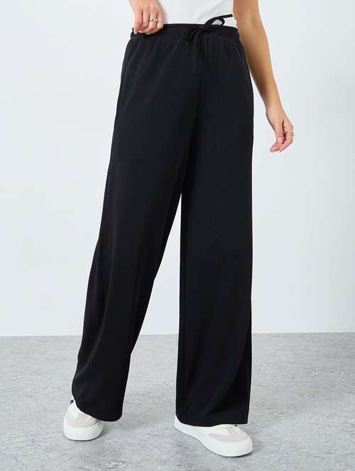women solid high rise relaxed fit track pant - 22219919 -  Standard Image - 0