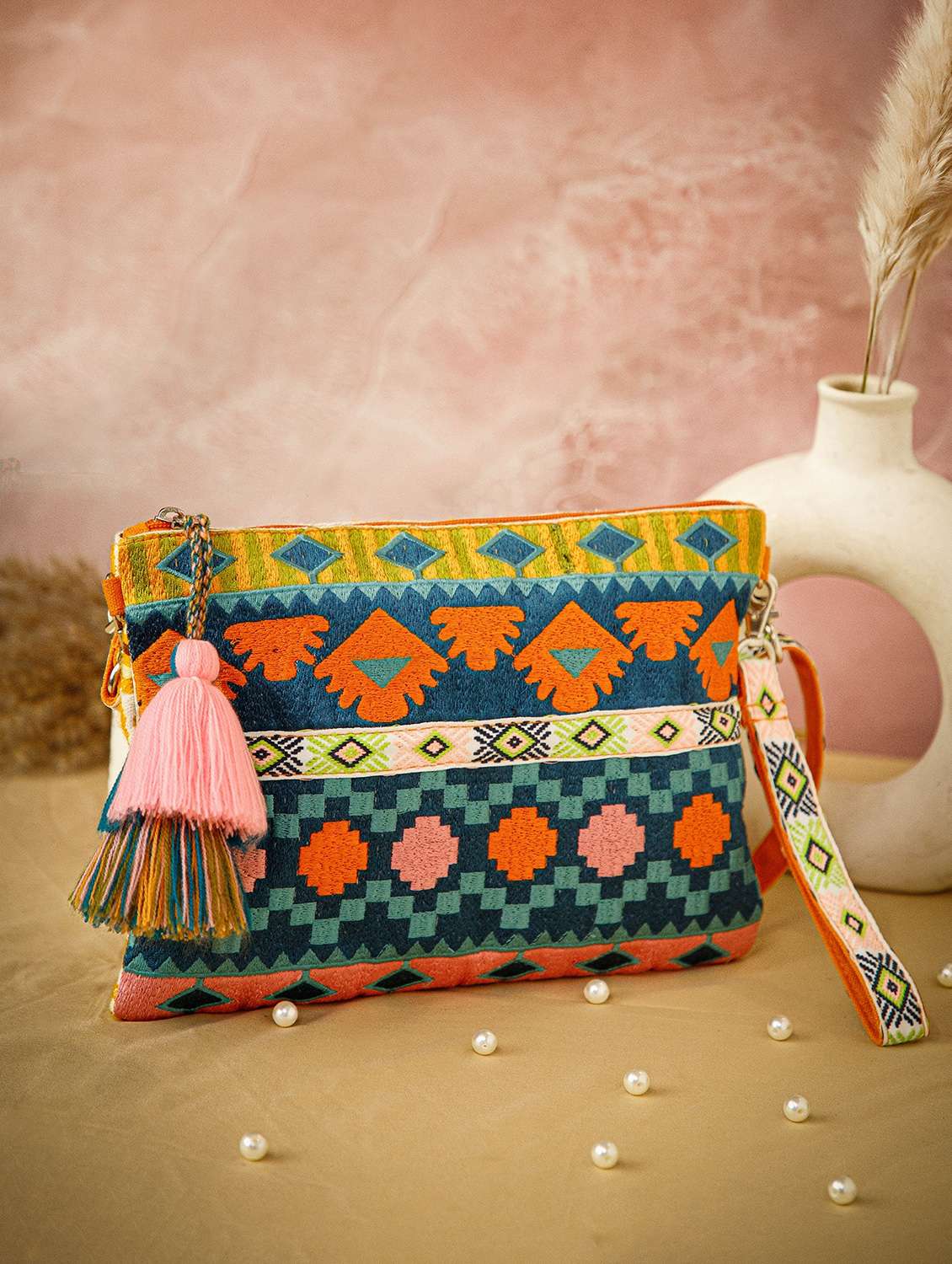 embroidered sling bag with tribal design