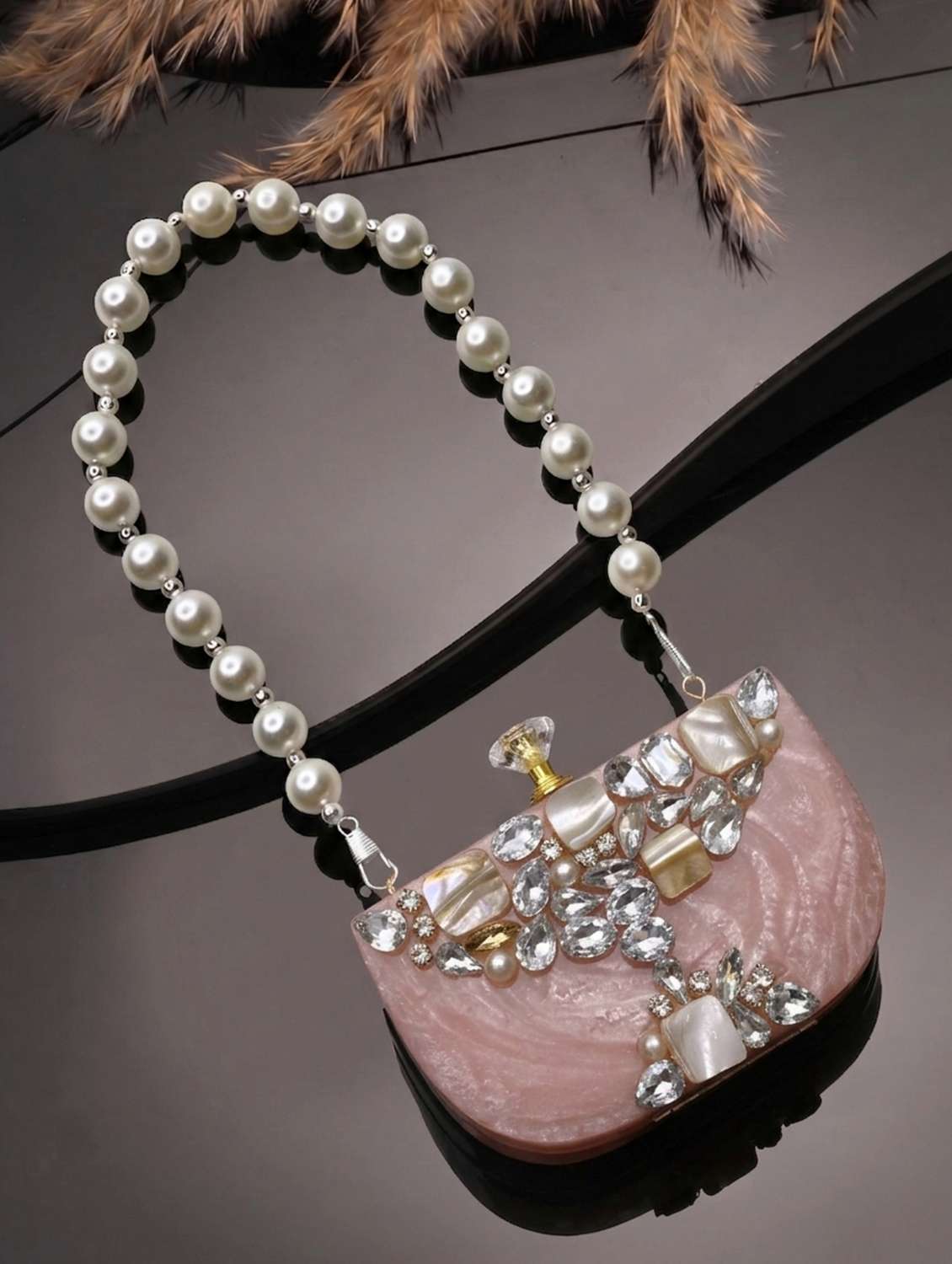 embellished pink clutch with pearl strap 