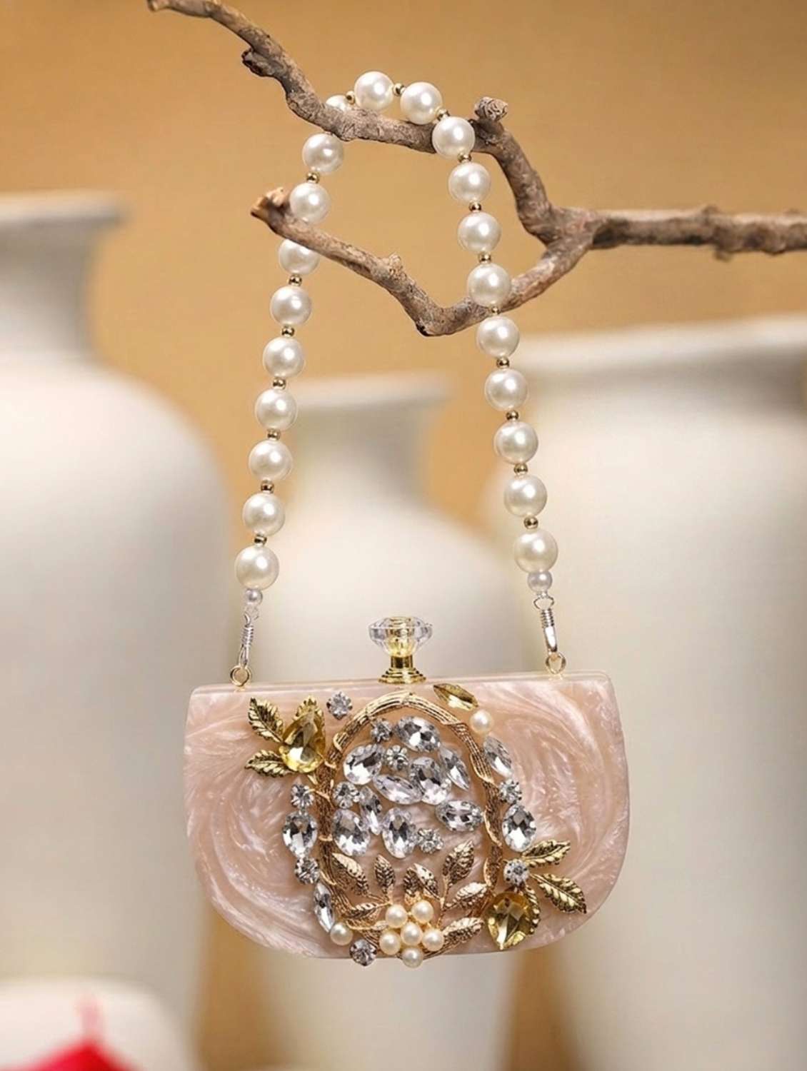 embellished beige synthetic clutch with strap