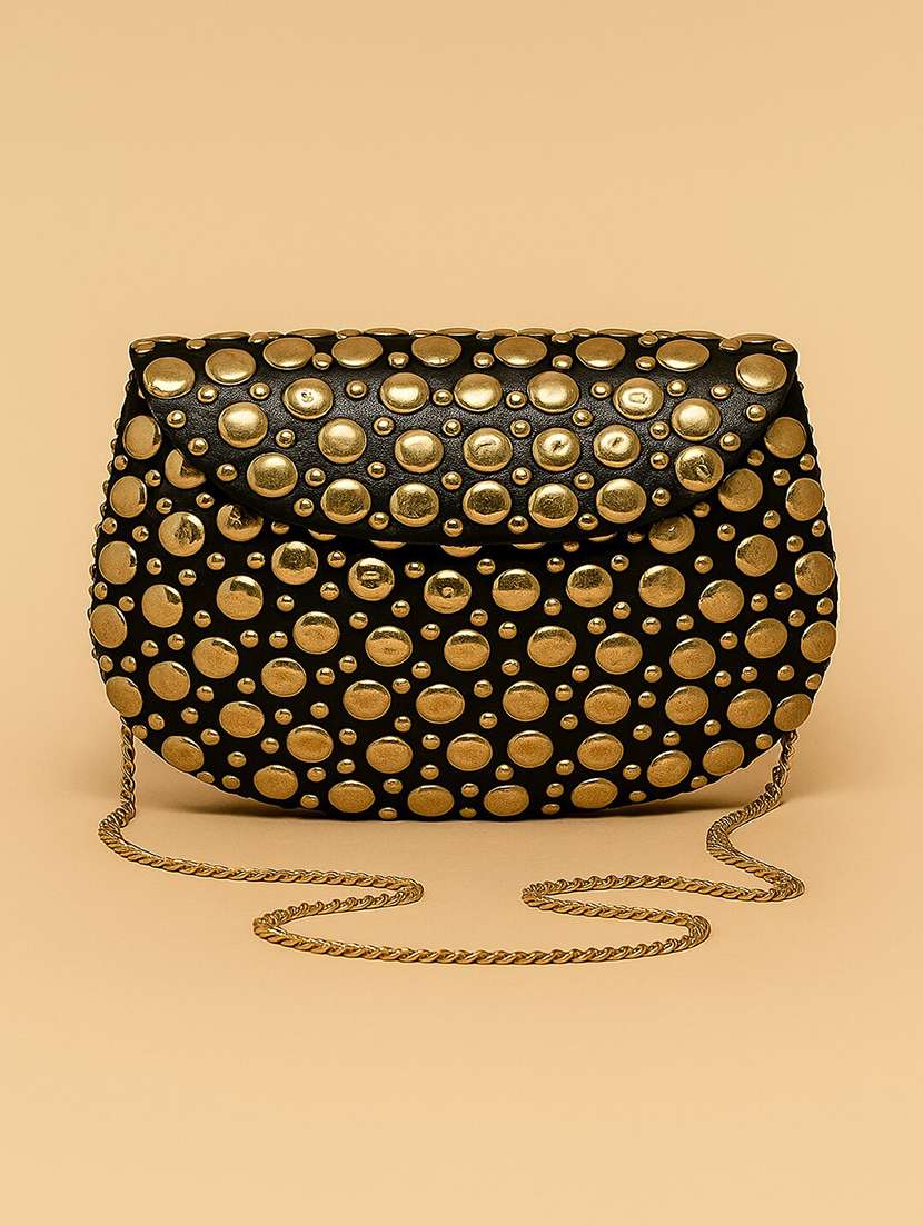 women embellished black clutch