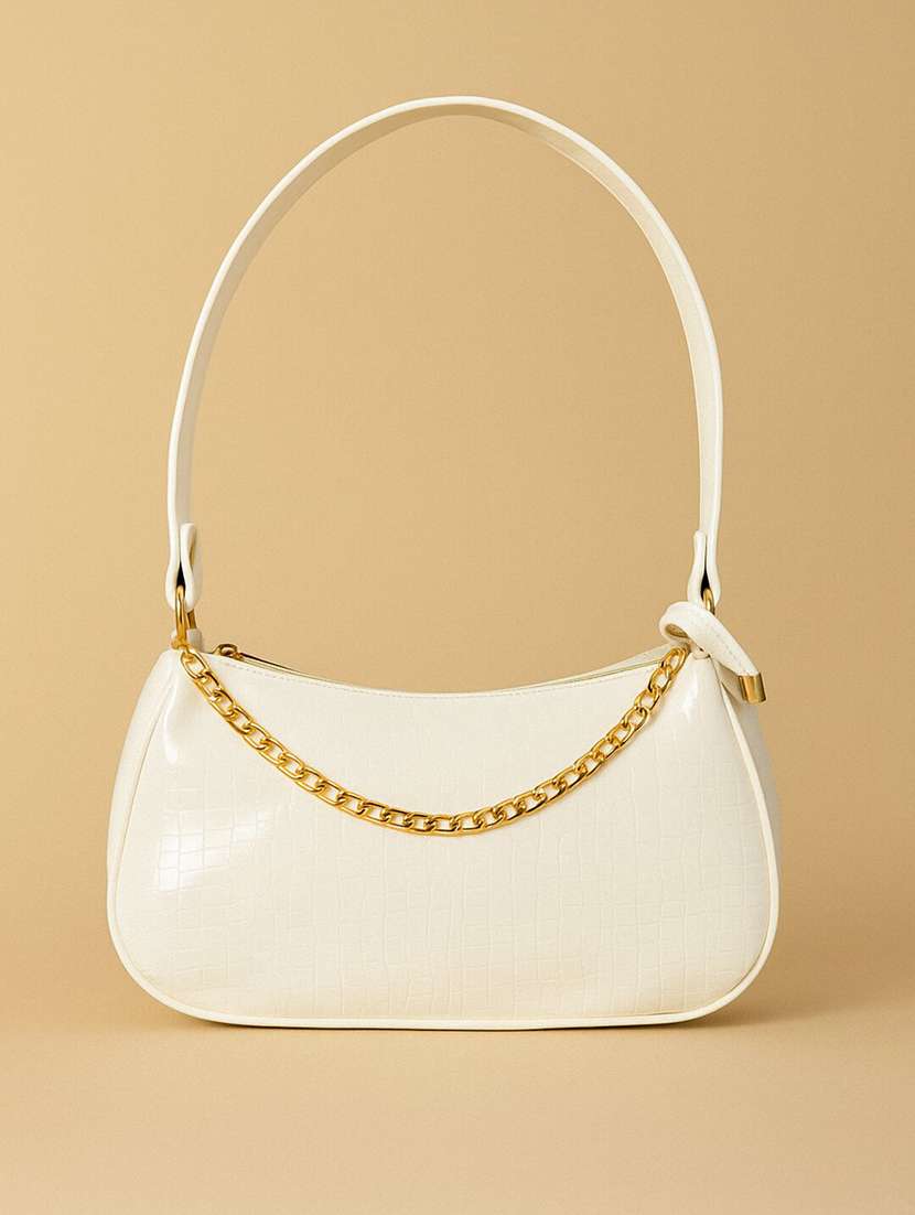 white sling bag with chain detail