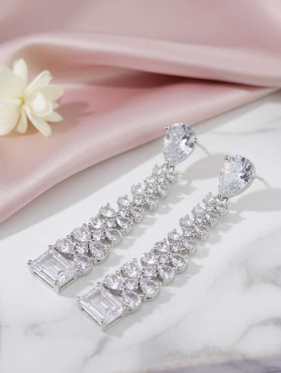 women stone studded dangle earrings