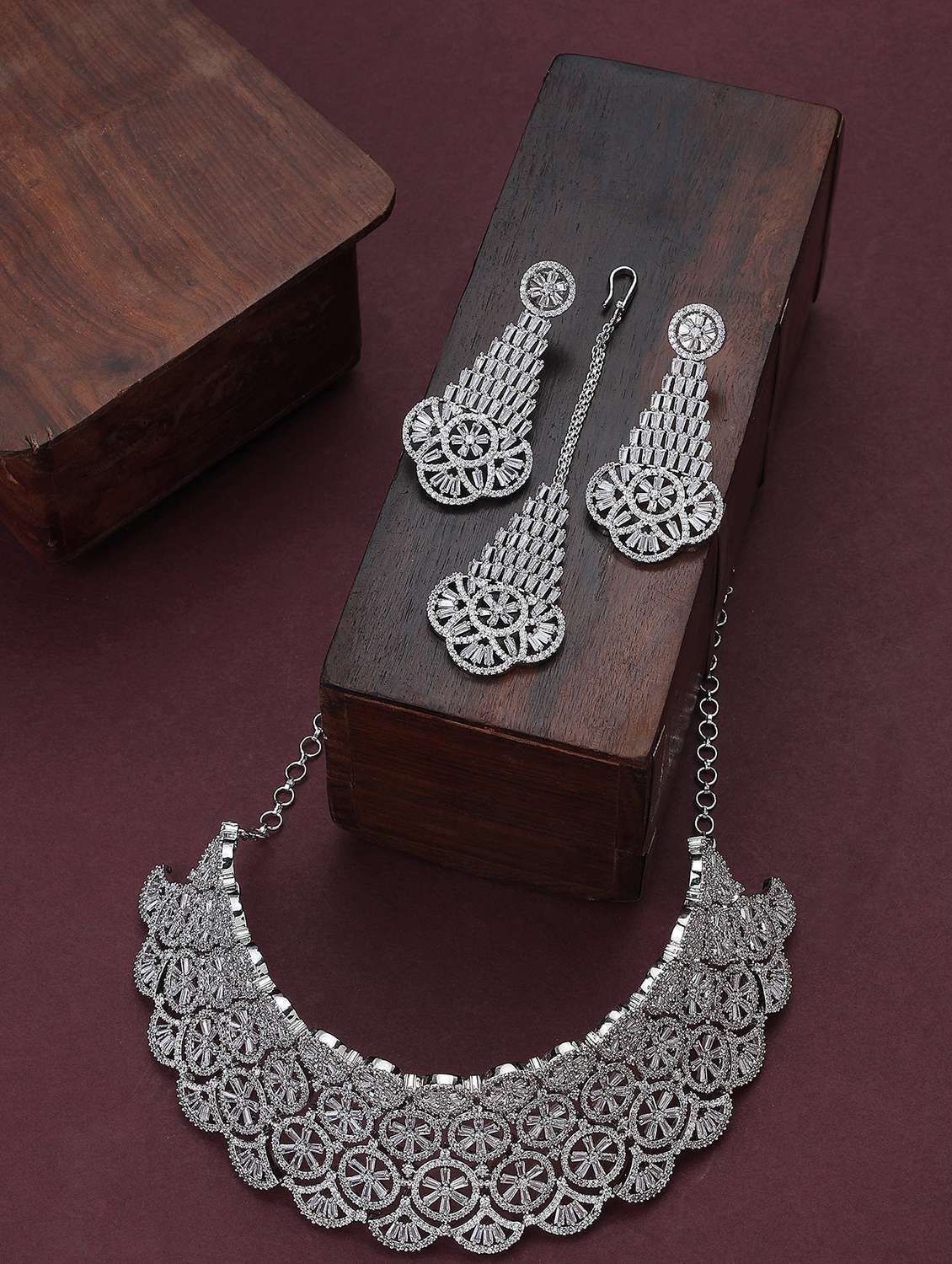 women stone studded necklace with earring and mangtikka set