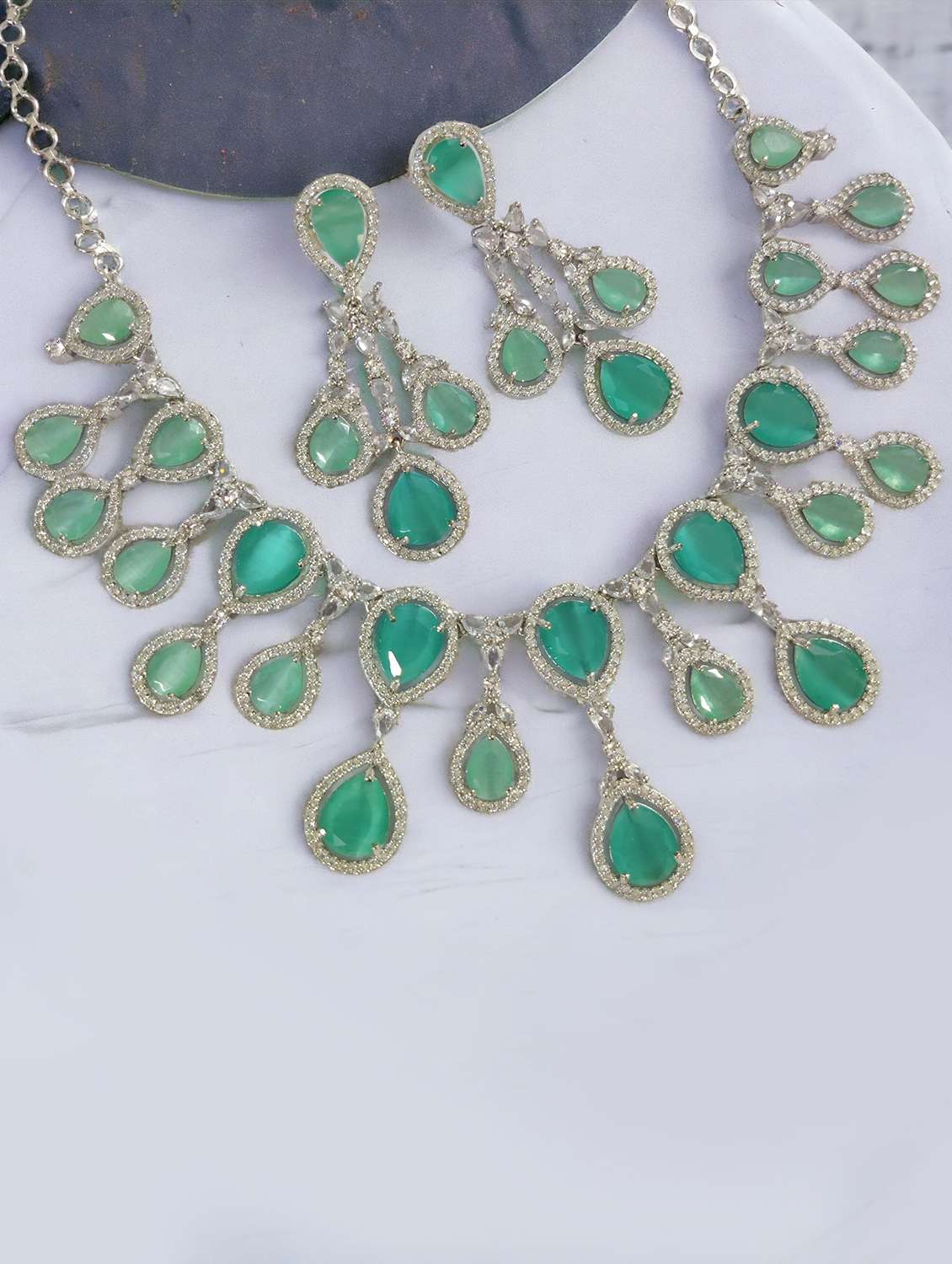 women stone studded necklace and earring set