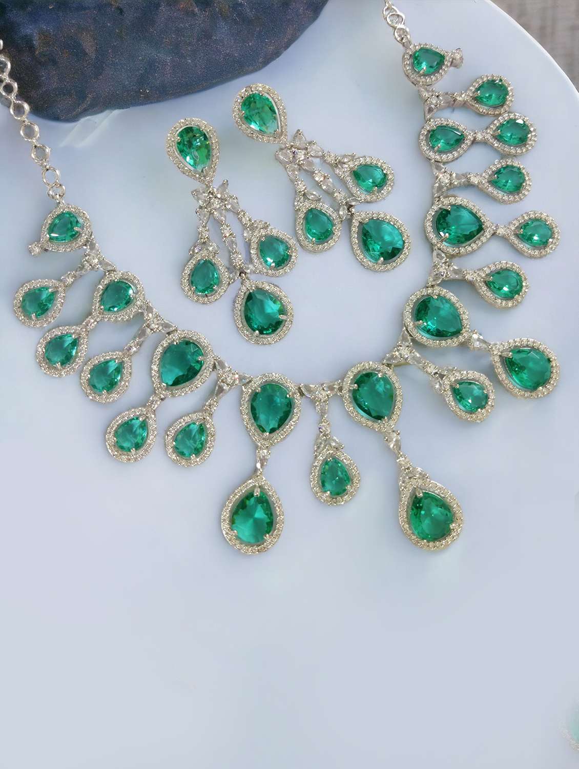 women stone studded necklace and earring set