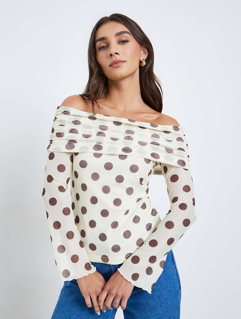 women polka doted off shoulder long sleeve top