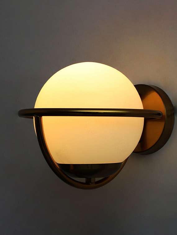 elegant globe wall sconce in brushed brass
