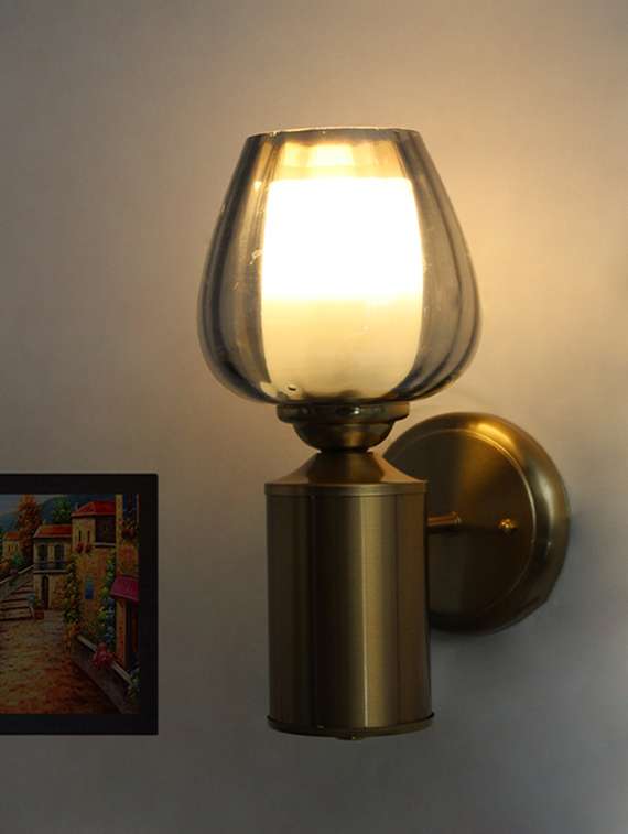 vintage brass wall light with smoked glass globe