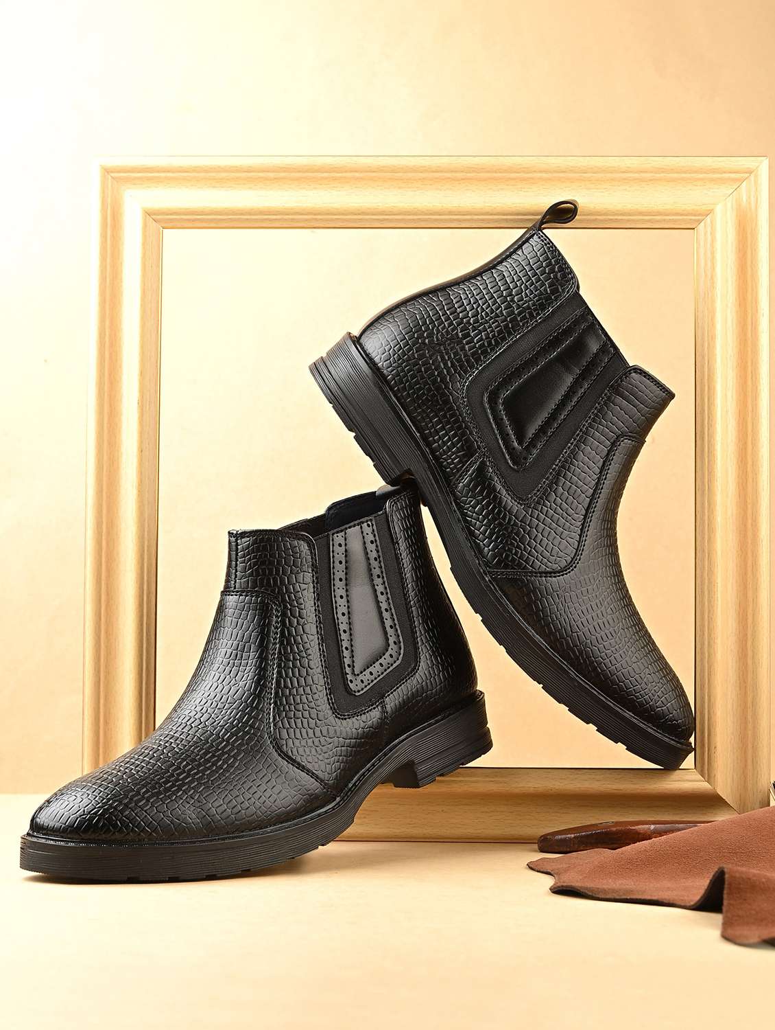 black synthetic slip on boots