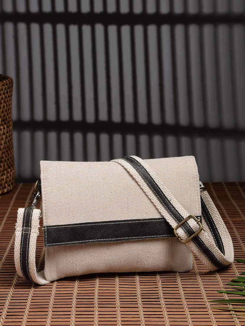 women solid sling bag with adjustable strap