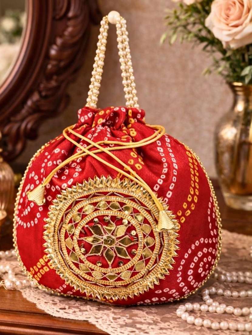 women embellsihed potli bag