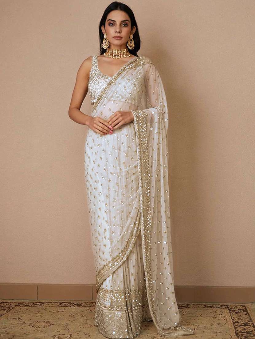 women solid with work embellished saree with blouse