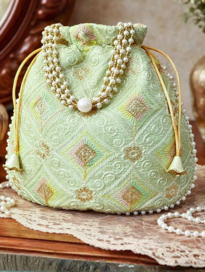 women solid with work embroidered potli