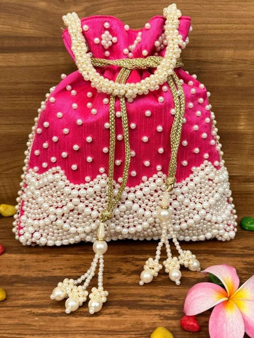 women solid with work embellished potli