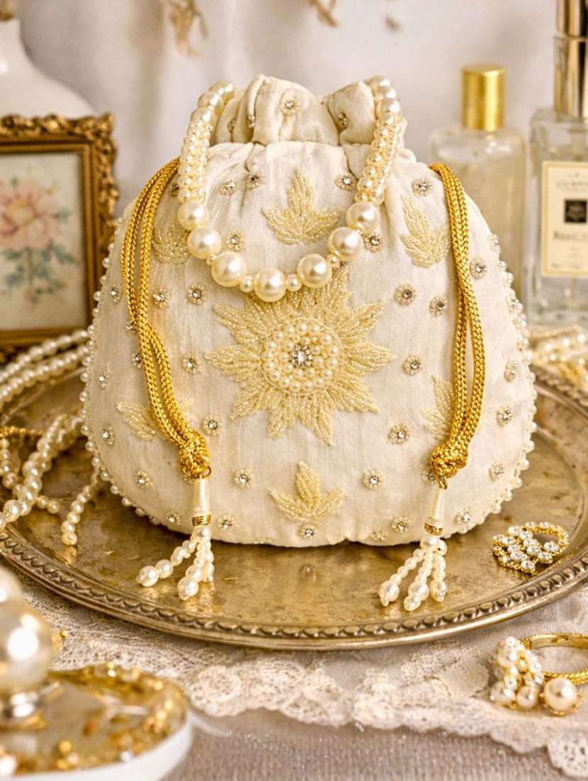 women solid with work embellished potli