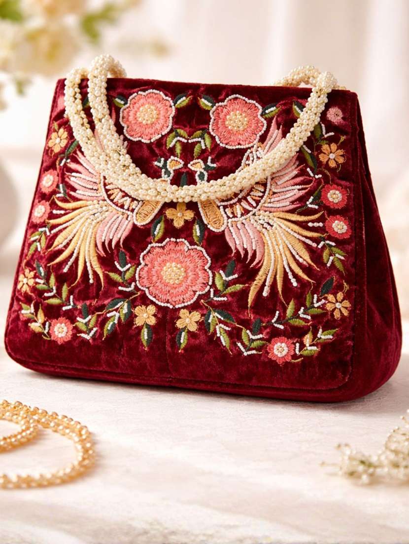 women solid with work embroidered potli