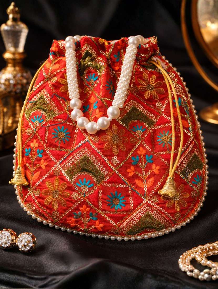 women solid with work embroidered potli