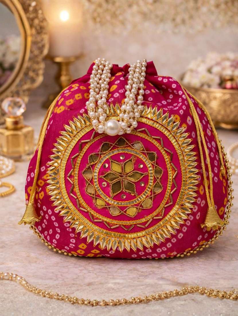 women solid with work embroidered potli