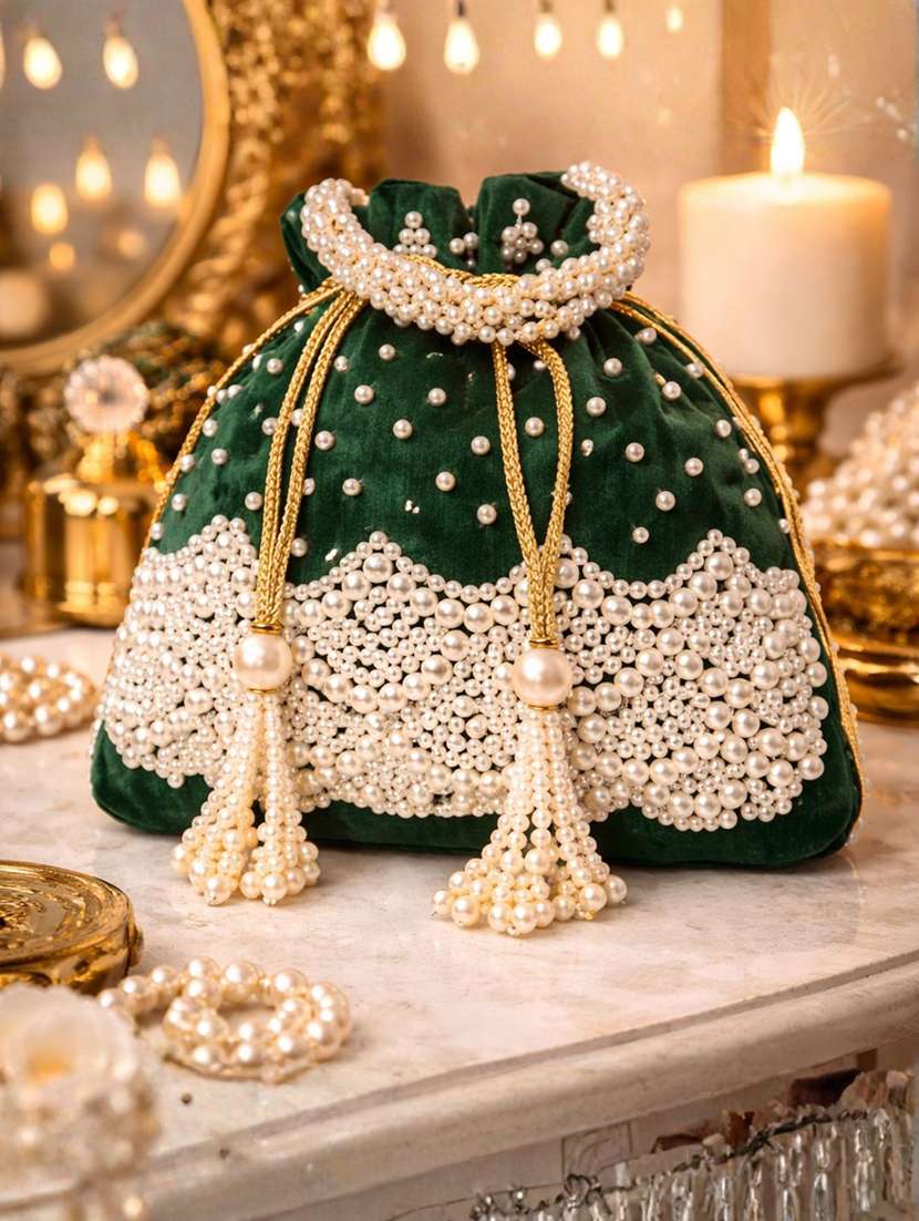 women solid with work embellished potli