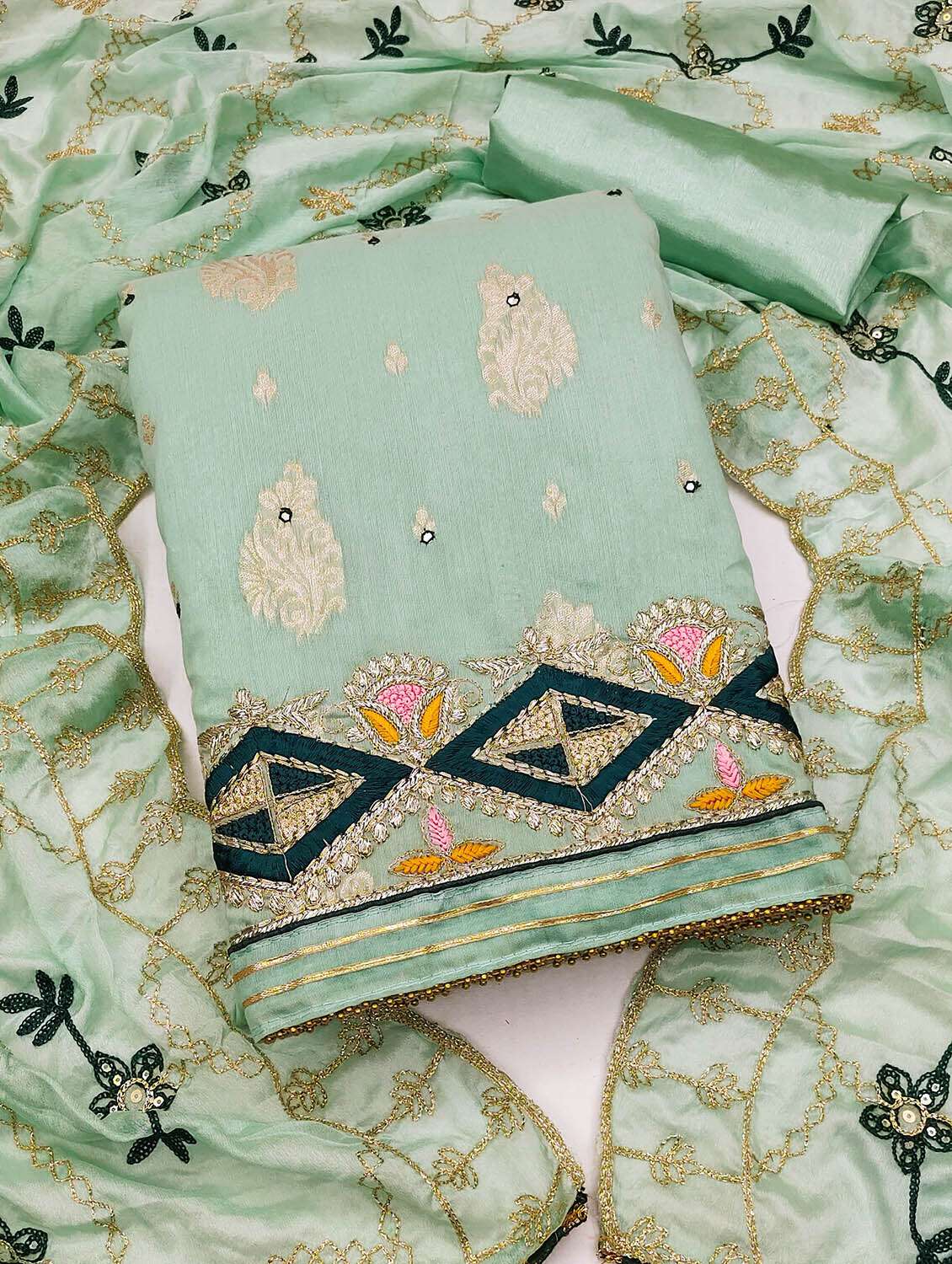 women self design unstitched suit set