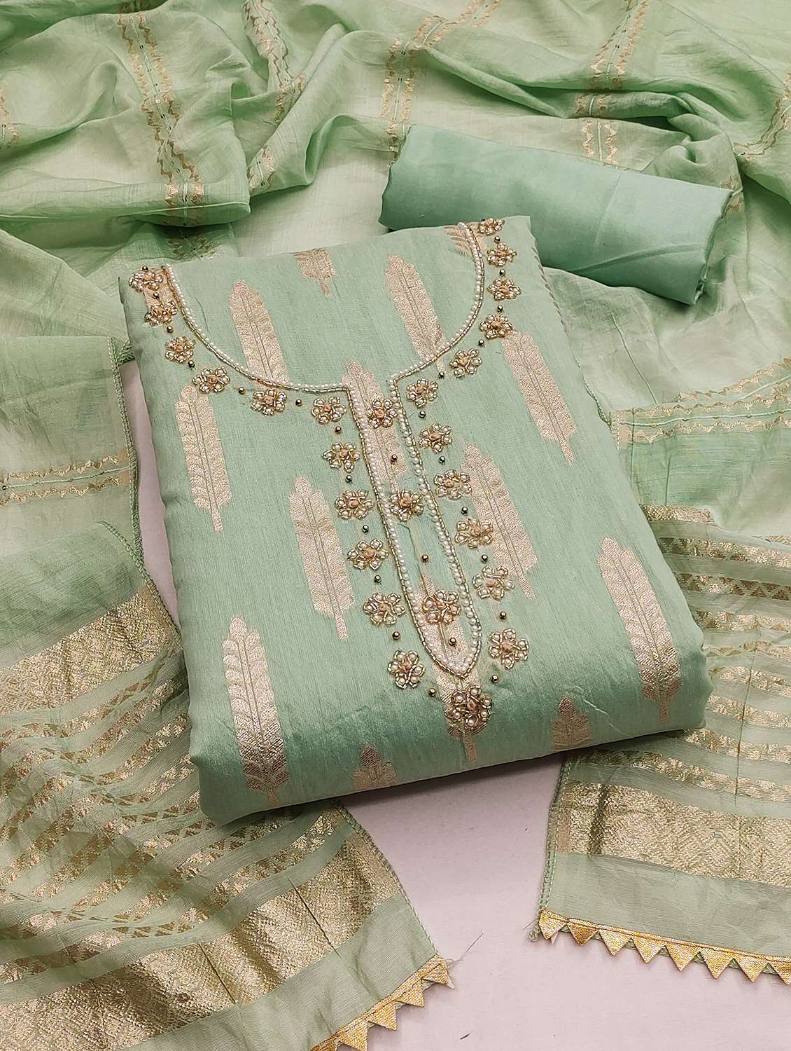 women self design unstitched suit set