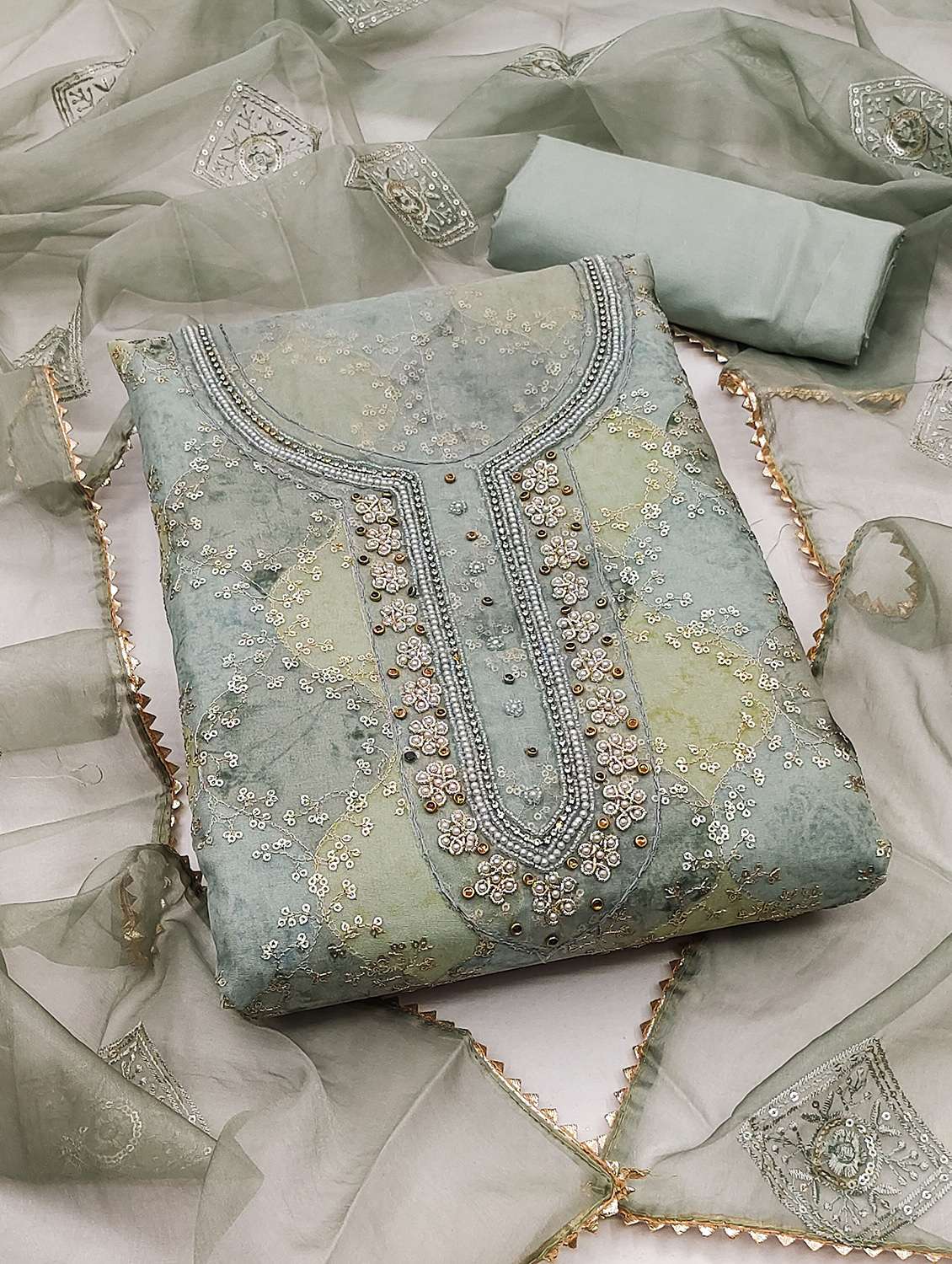 women printed unstitched suit set