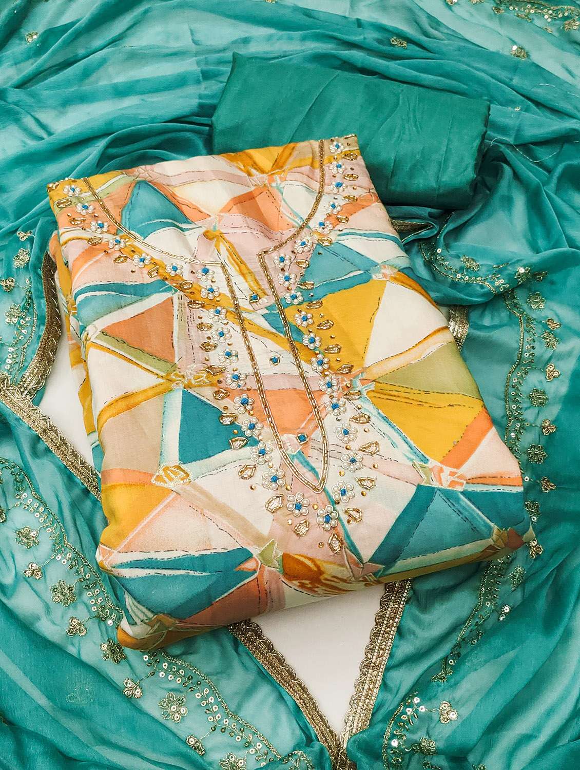 women printed unstitched suit set