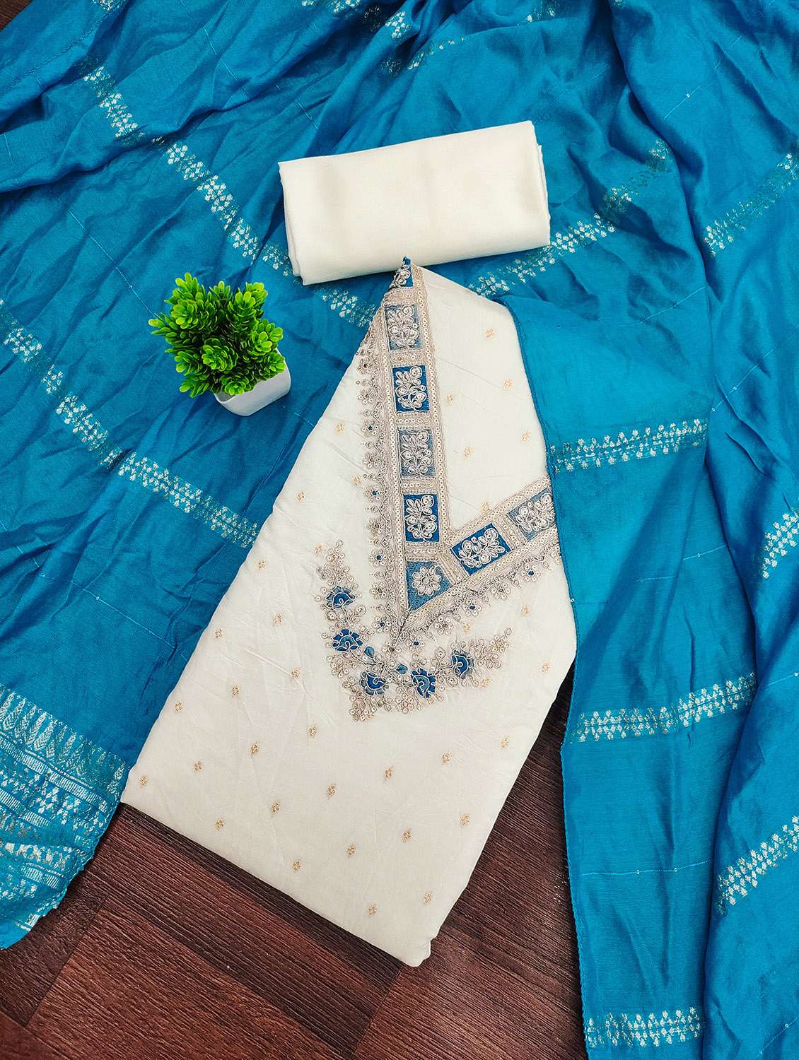 women self design unstitched suit set