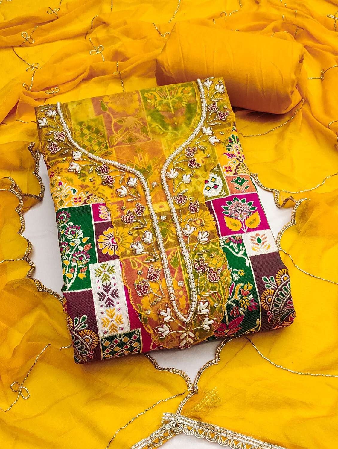 women self design unstitched suit set