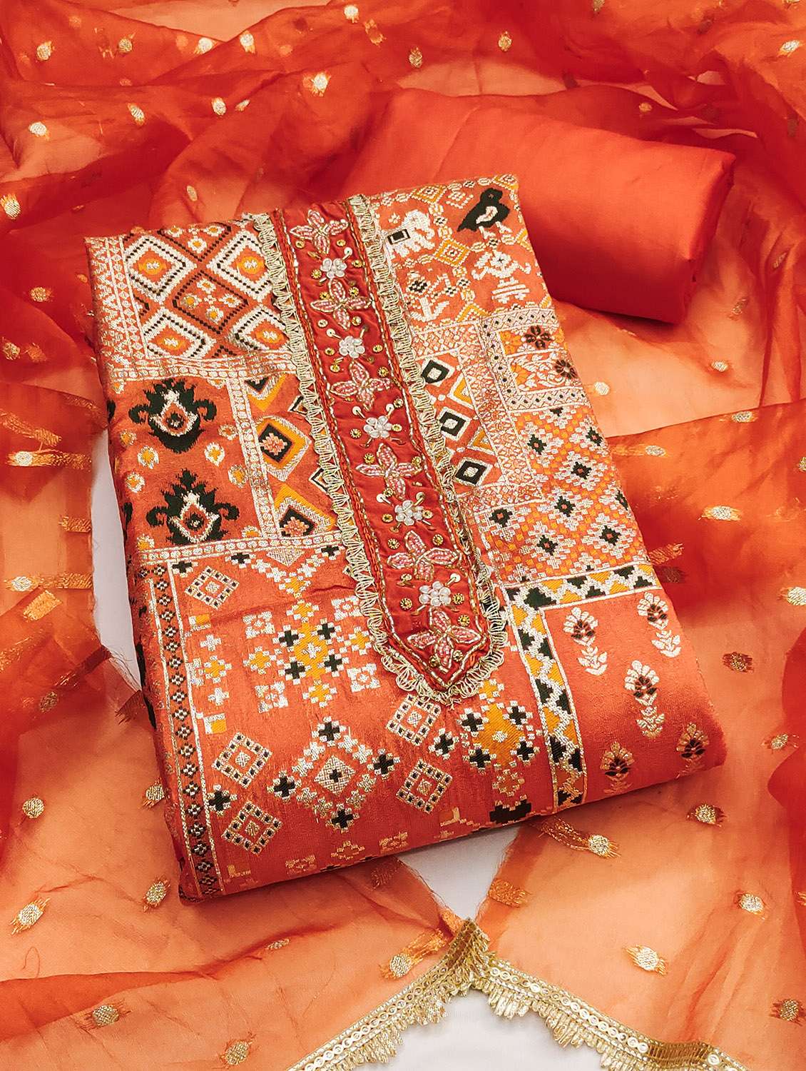 women self design unstitched suit set