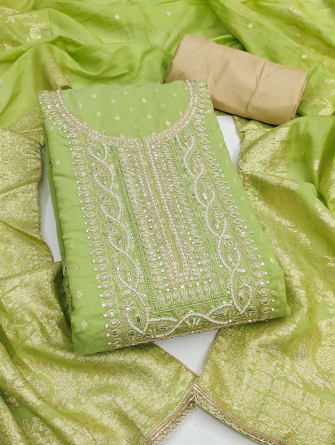 women self design unstitched suit set