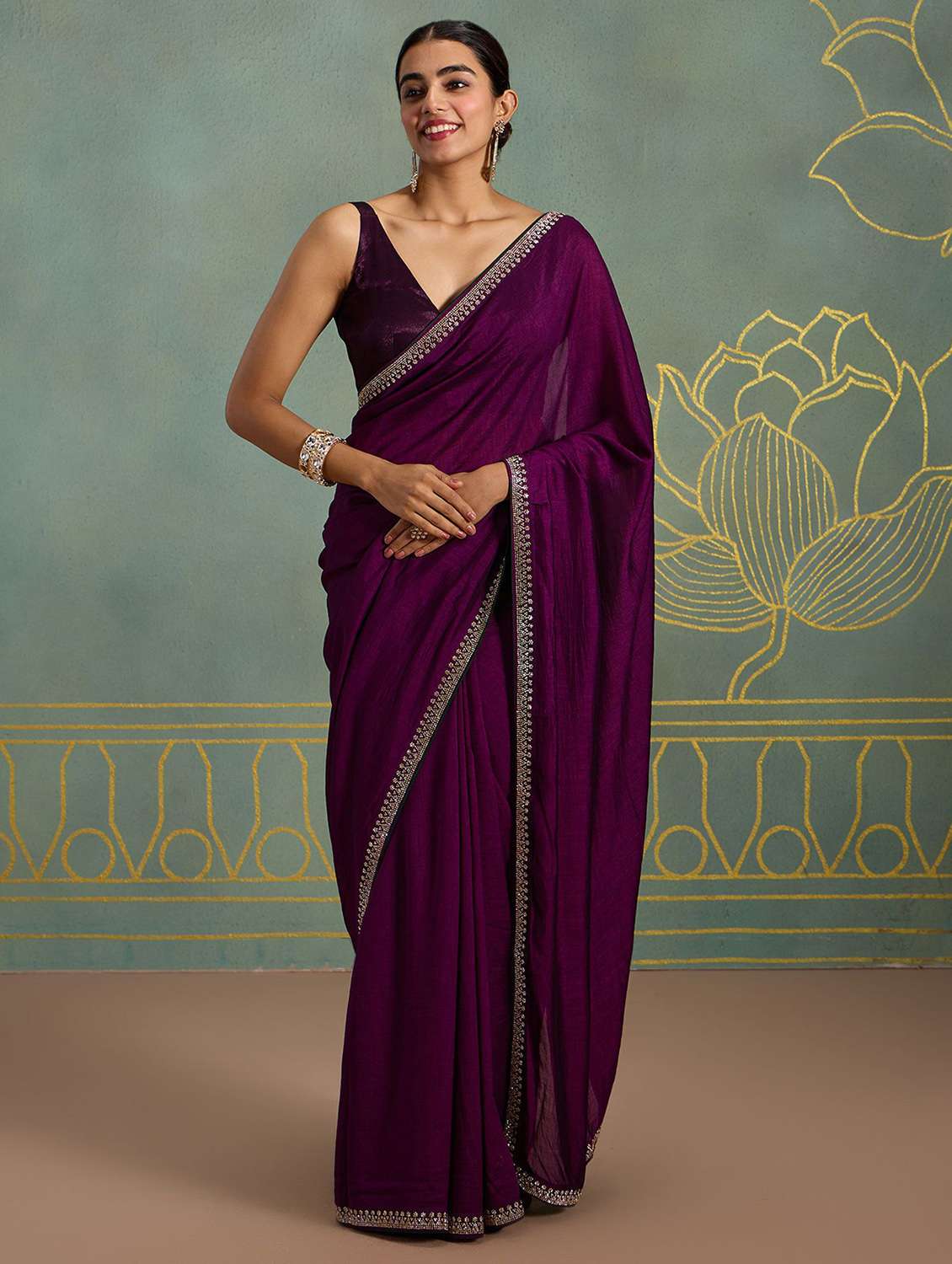 women solid with embellished bordered saree