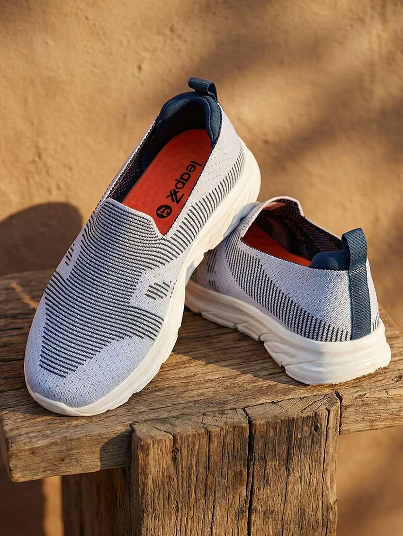 women teal slip on sports shoe