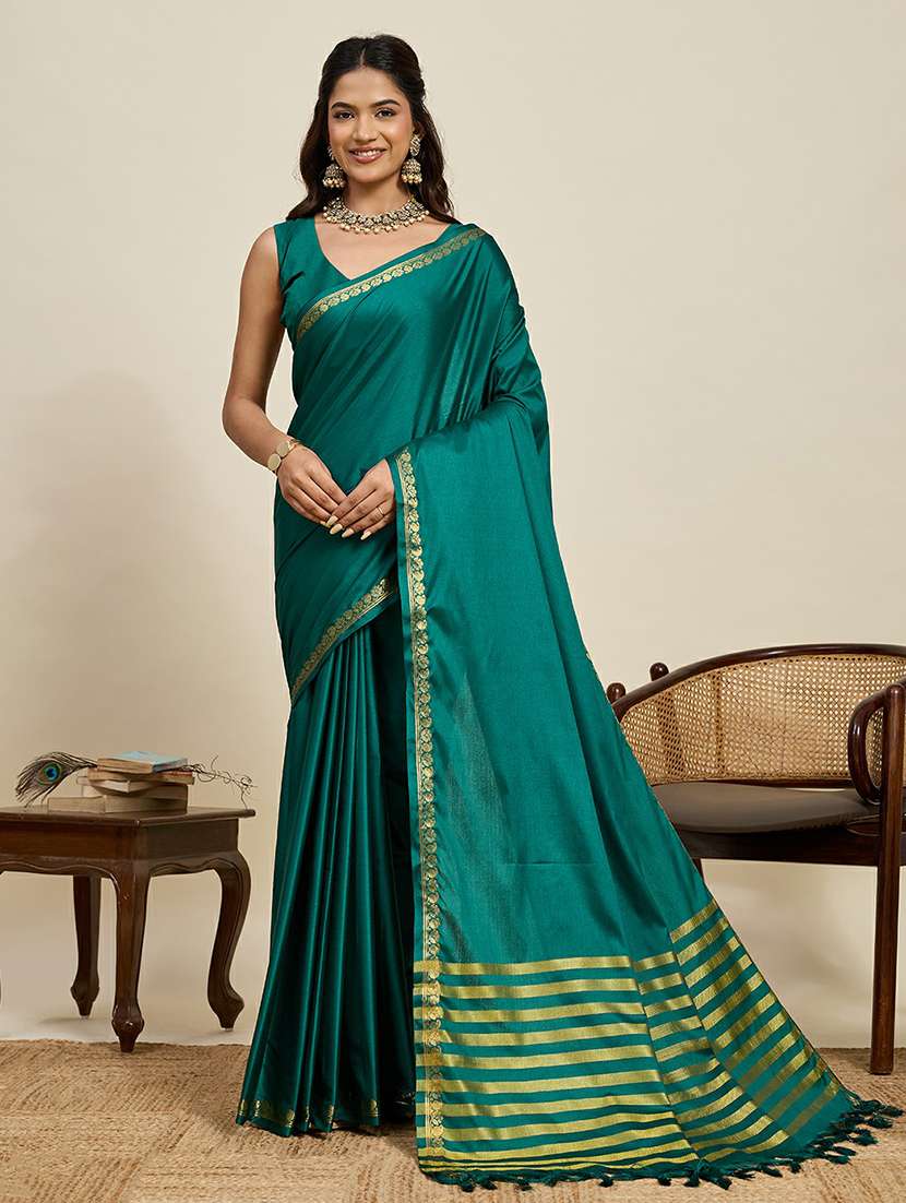 women turquoise embellished saree with blouse