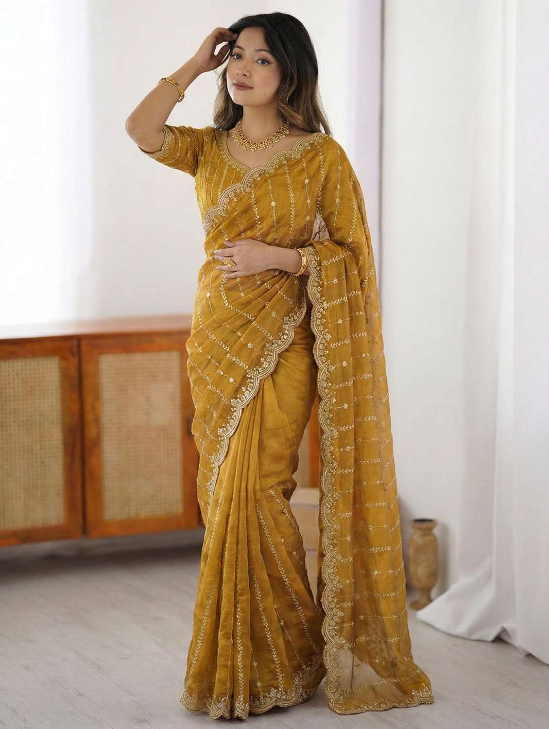 women mustard embellished saree with blouse