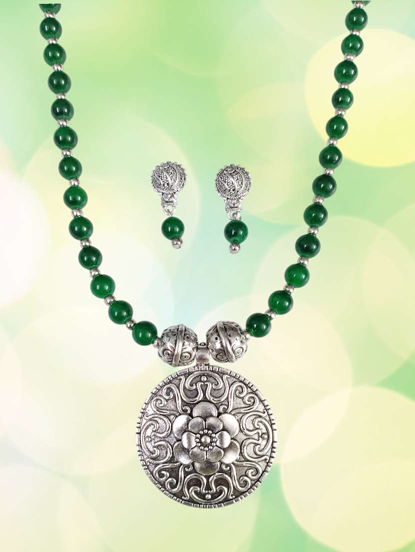 green oxidised metal necklace and earring set with pendant